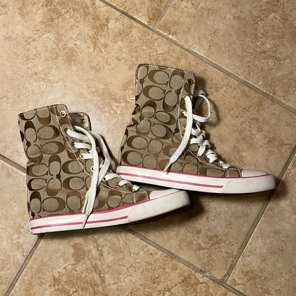 Coach pink high top reversible sneakers.